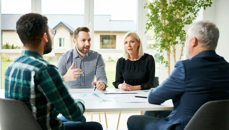 Mortgage consultant discussing home equity options with clients